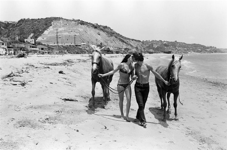 Jan-Michael Vincent with girlfriend Bonnie Poorman at the beach in Malibu, CA 1969. - Morrison Hotel Gallery