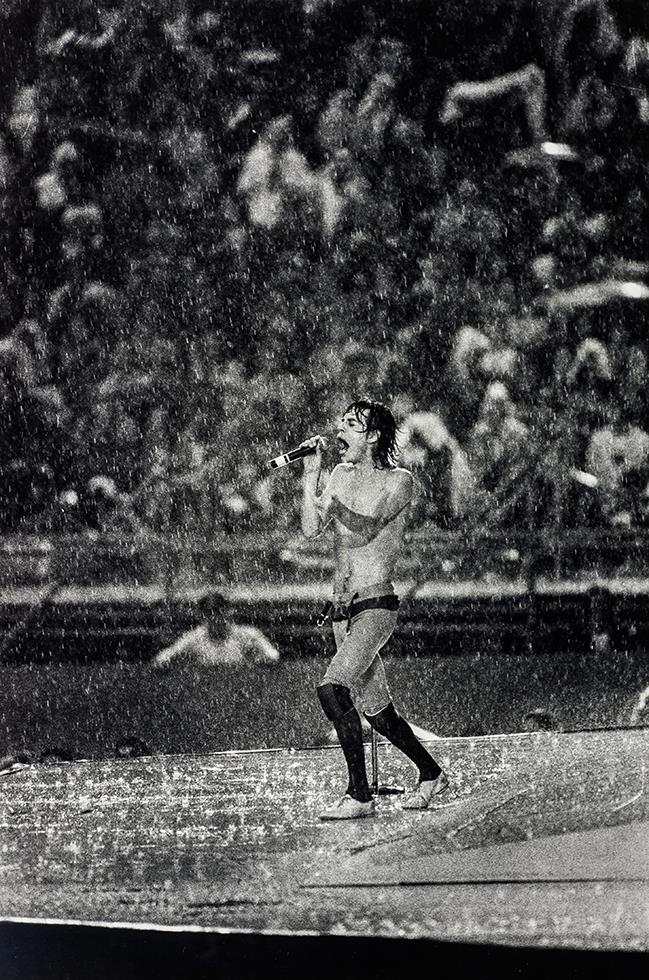 Mick Jagger in rainstorm, 1981 - Morrison Hotel Gallery