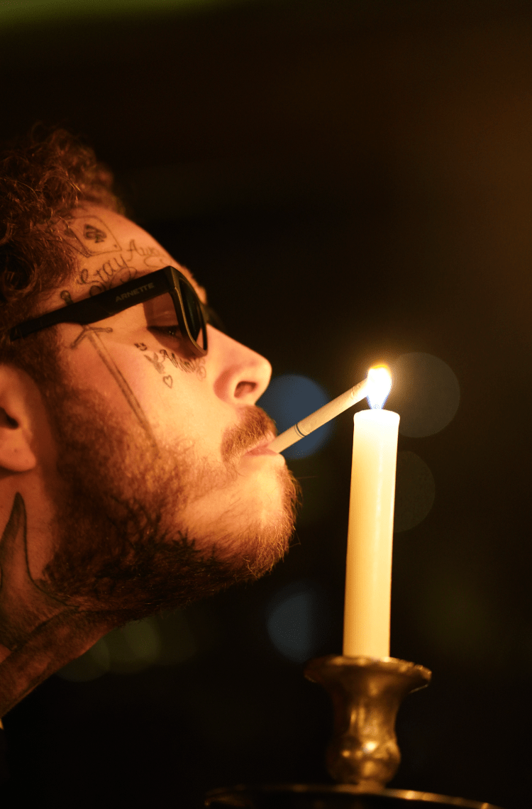 smoking cigarettes at night Post Malone, Lighting a Cigarette with Candle smoking cigarettes at night Post Malone, Lighting a Cigarette with Candle