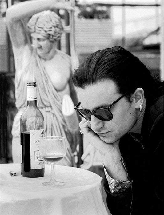 Bono with wine glass in Rome, Italy - Morrison Hotel Gallery