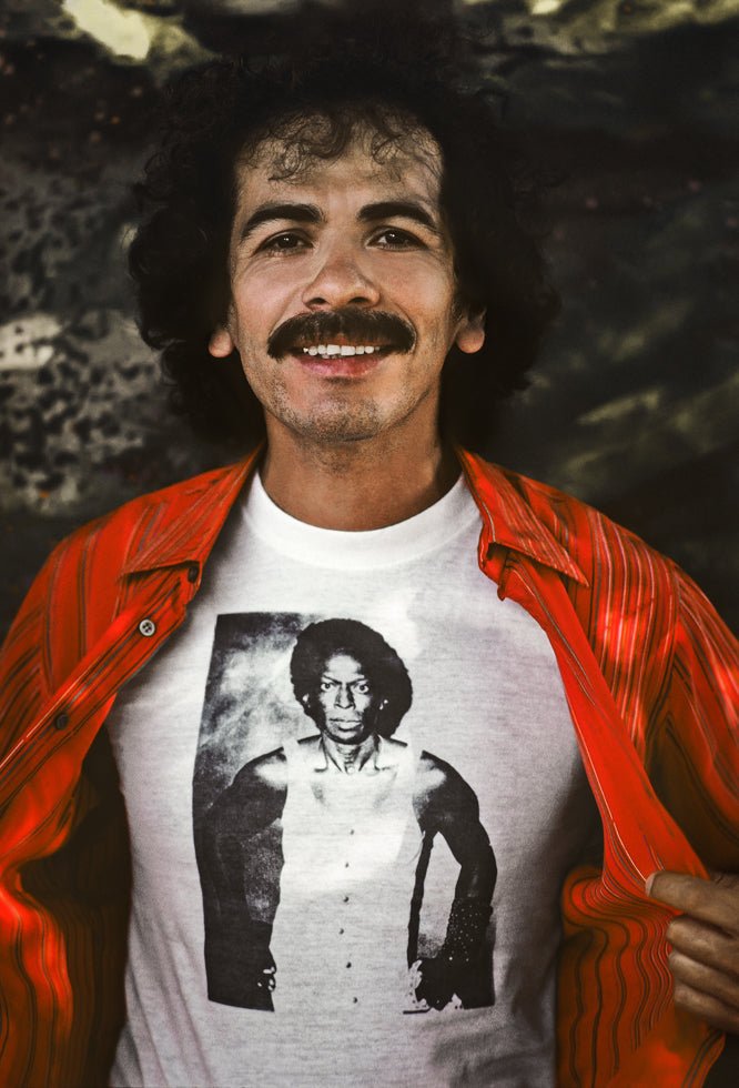 Carlos Santana with Miles Davis shirt, 1982 - Morrison Hotel Gallery