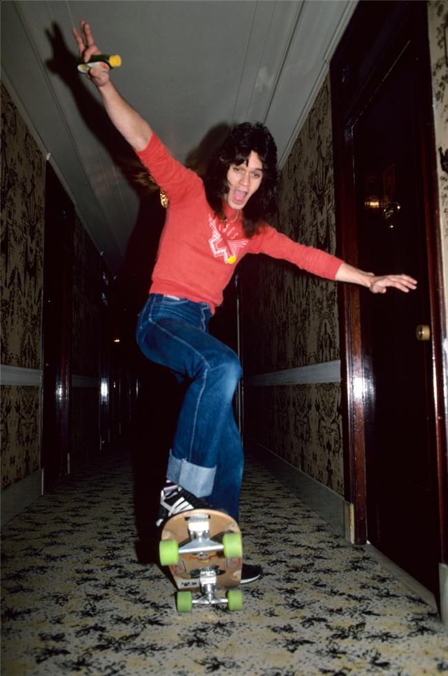 Eddie Van Halen skateboarding in a hotel hall - Morrison Hotel Gallery