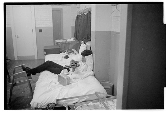 George Harrison on bed - Morrison Hotel Gallery