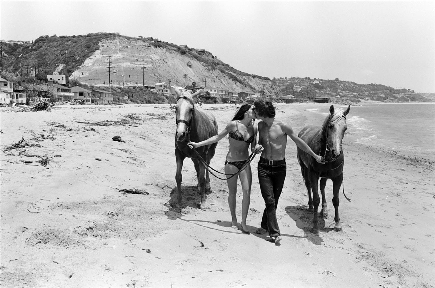 Jan-Michael Vincent with girlfriend Bonnie Poorman at the beach in Malibu, CA 1969. - Morrison Hotel Gallery
