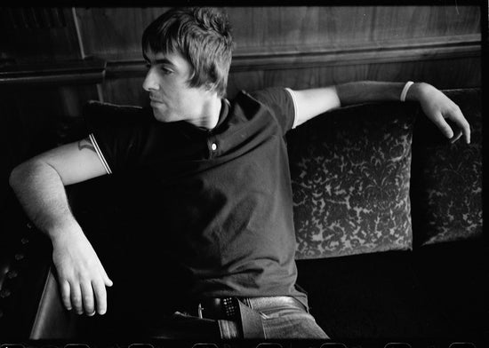 Oasis, Liam Gallagher on Couch, Montreal, Canada, 2008 - Morrison Hotel Gallery