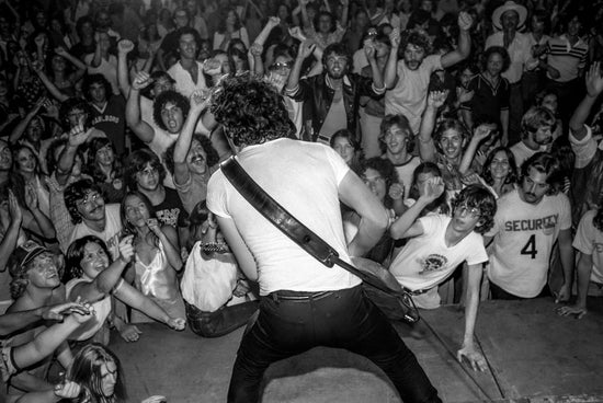 Stage Shot of Bruce Springsteen Performing with Fans, 1978 - Morrison Hotel Gallery