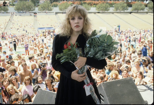 Stevie Nicks on stage with roses at Rock N' Run benefit at UCLA on April 1, 1983 - Morrison Hotel Gallery